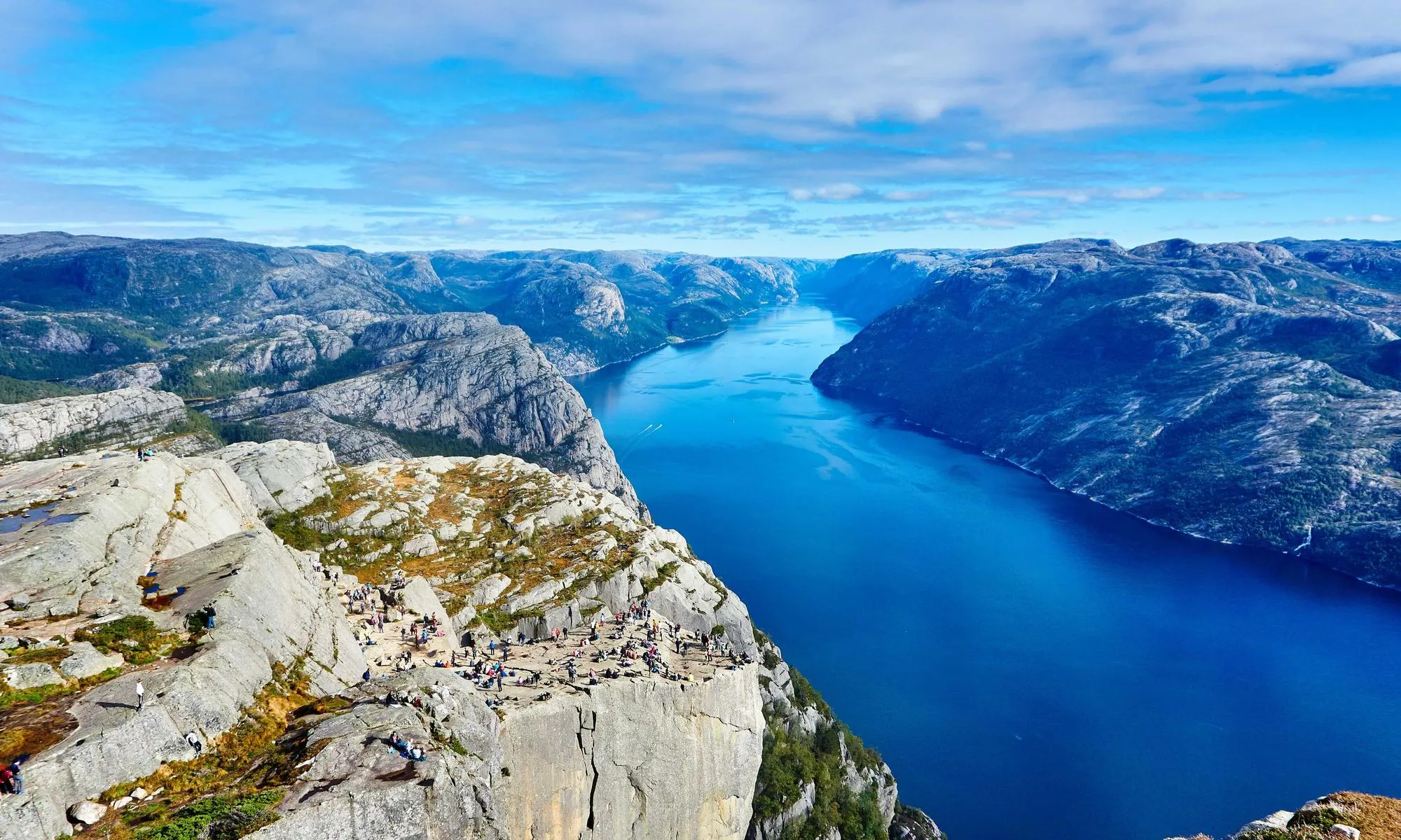 A deep blue fjord between rocky cliffs